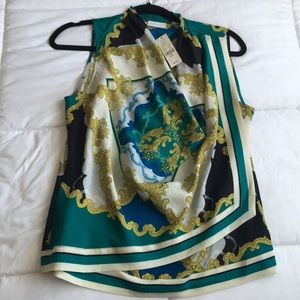 Multi colored layered blouse, plunged neckline.